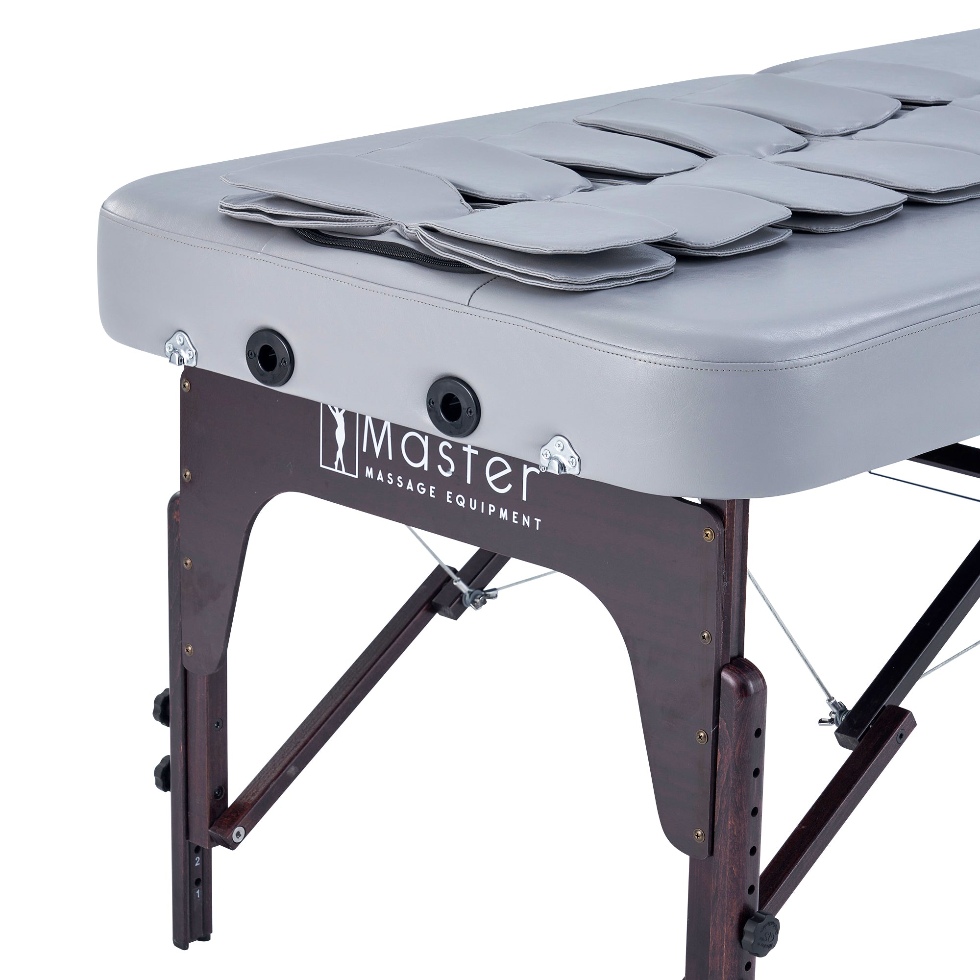 Master Massage BRISTOL Airwave Stretching Table with folded pads on sturdy wooden legs.