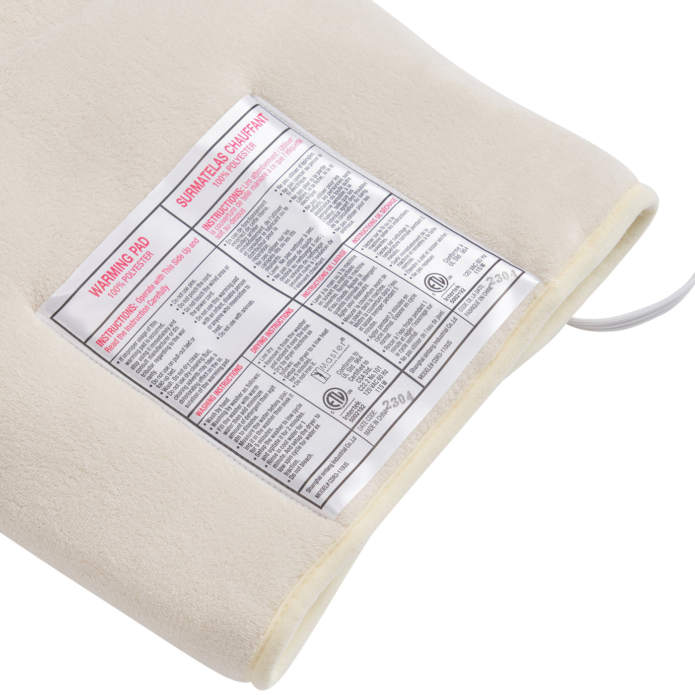 Beige heating pad with a warning label on a white background