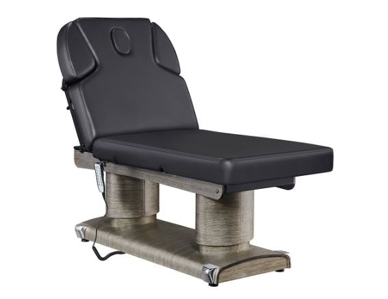 Luxi 4 Motors Medical Spa Treatment Table by DIR, black with headrest and metallic base.