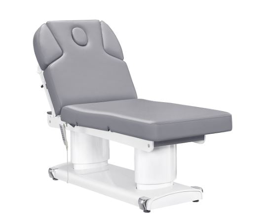 The DIR Luxi 4 Motors gray medical spa chair features a white base, ideal for treatments.