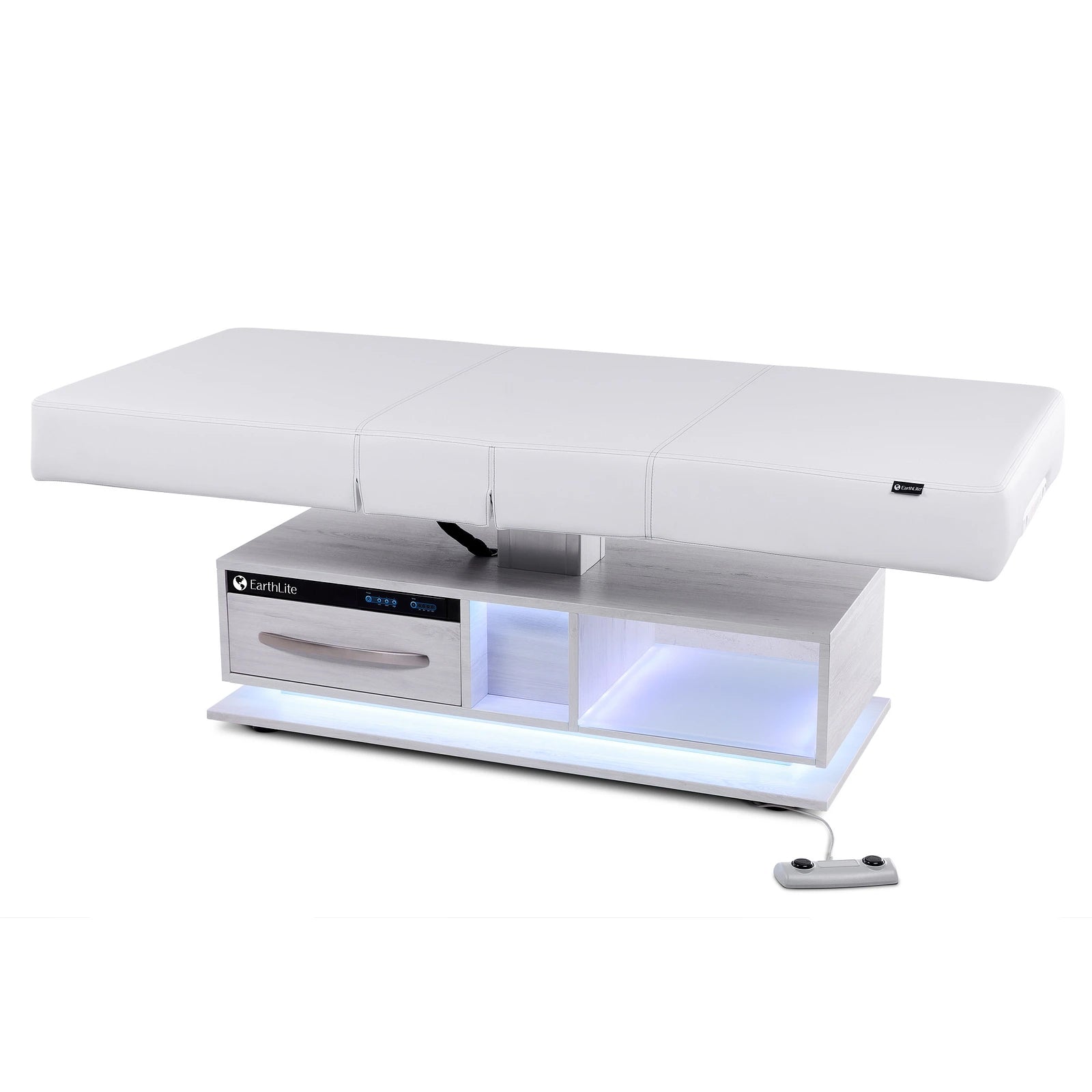 EarthLite EVEREST ECLIPSE 2.0 salon massage table with storage and remote control on the floor.