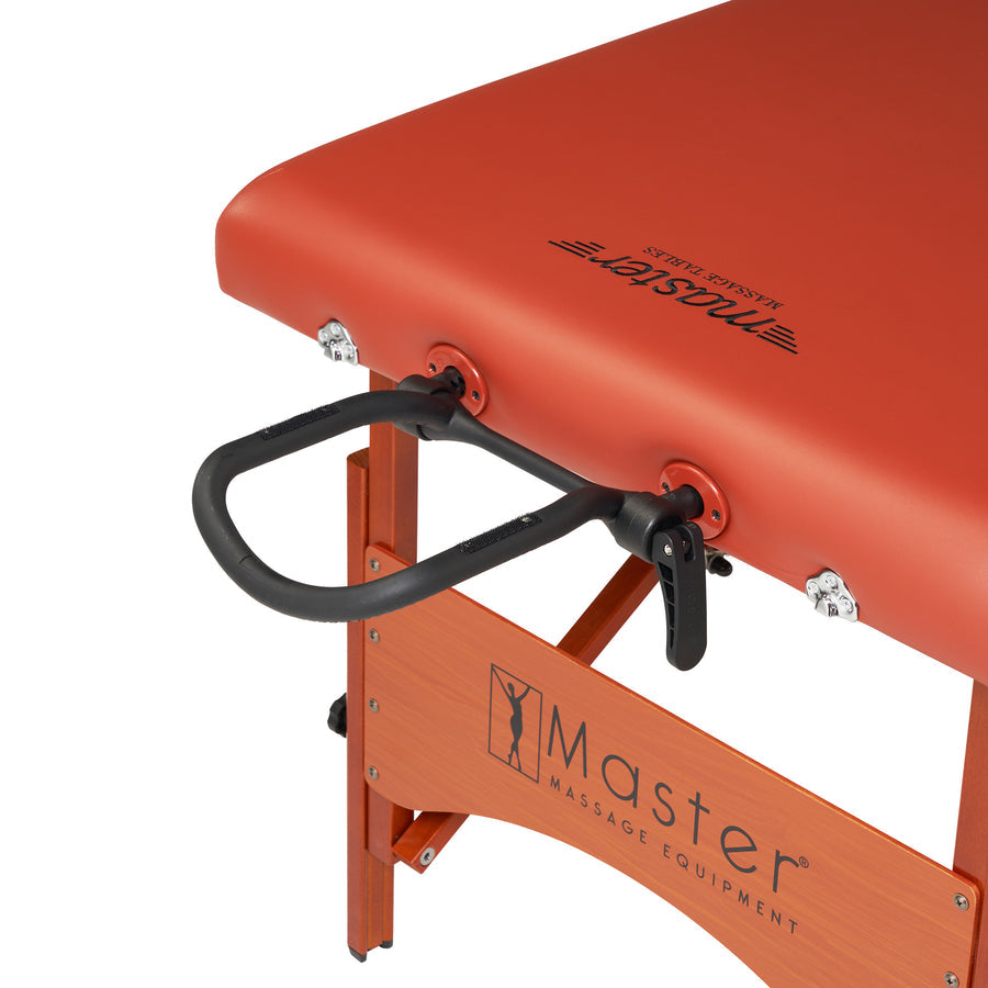 Close-up of the Master Massage FAIRLANE Therma-Top Table with orange finish and black armrest.