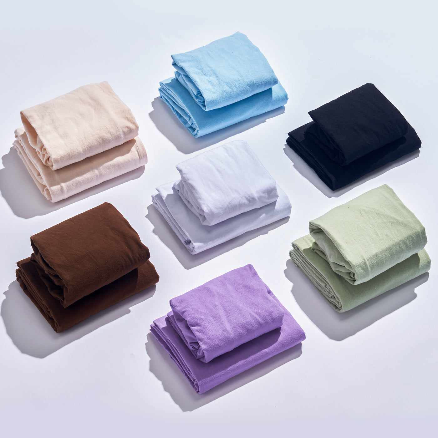 Set of Master Massage Cotton Flannel Sheets Set (3 Piece Set) in various colors on a light gray background