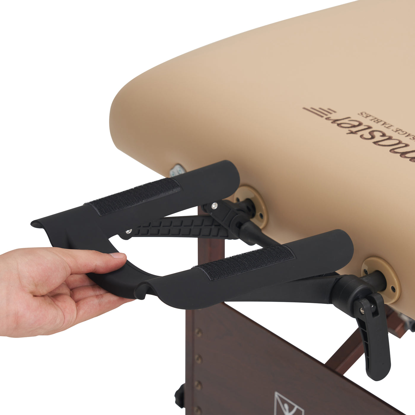 Hand holding a black Master Massage ErgoCaptain Face Cradle
