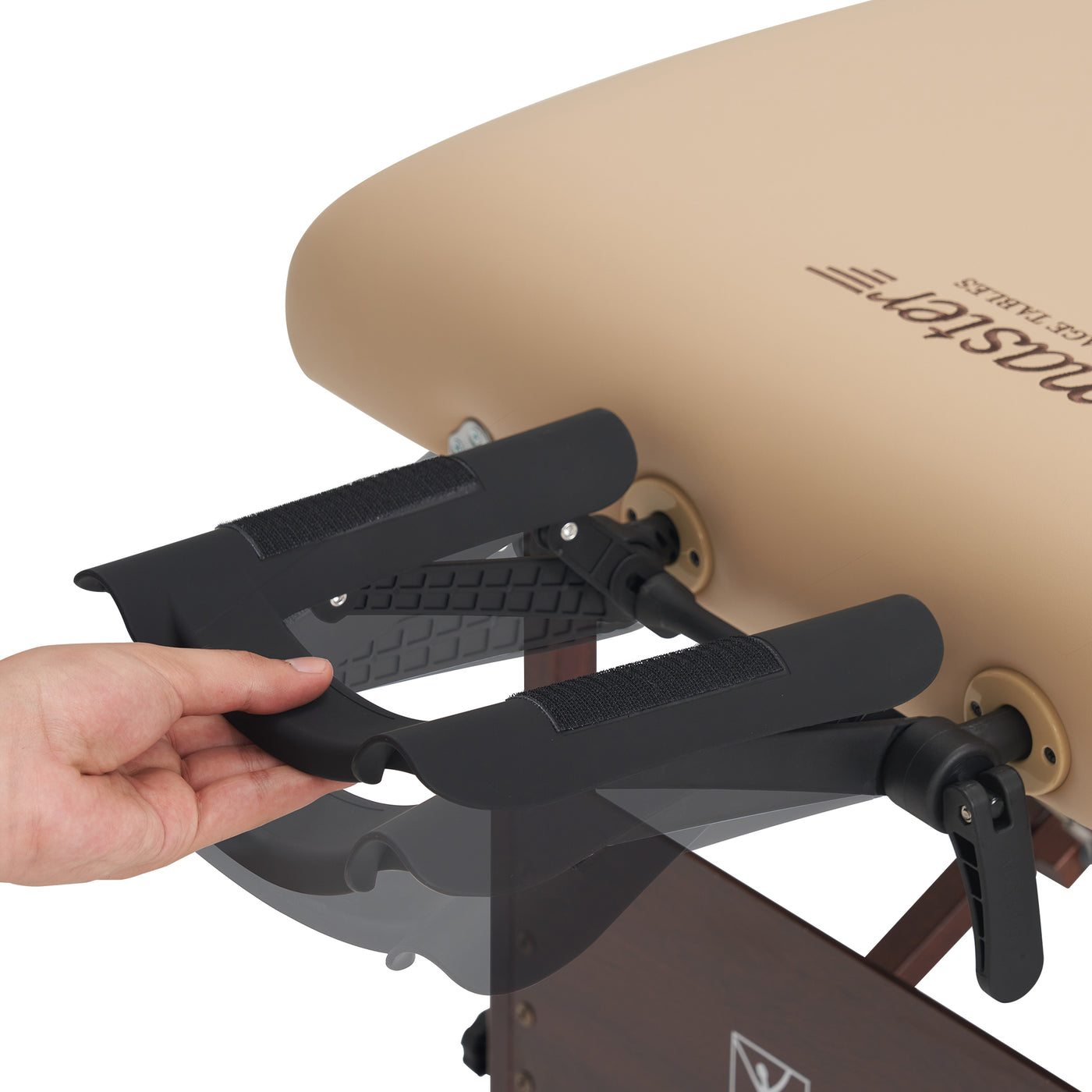 Hand adjusting a black Master Massage ErgoCaptain Face Cradle on a beige massage table with 'Master Massage' branding.