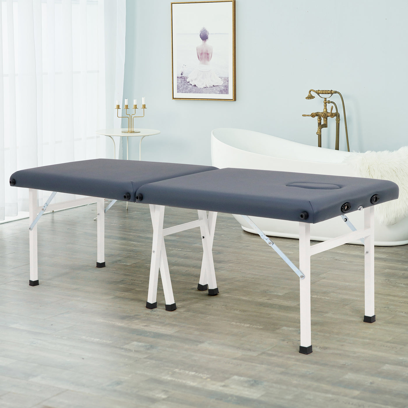 Master Massage Harmon Economic Portable Massage Table with white legs in a modern room.