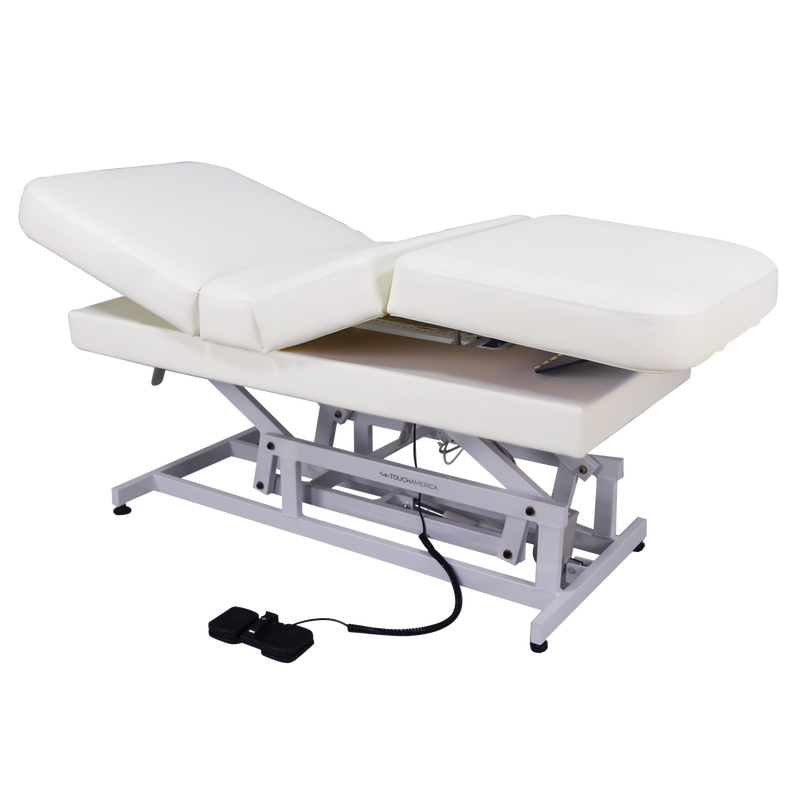 TouchAmerica HILO MULTIPRO ADA exam table with foot pedals and sturdy metal frame.