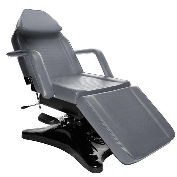 The Comfort Soul HYDRAULIC PRO Facial Chair/Bed is gray with armrests and a padded footrest.