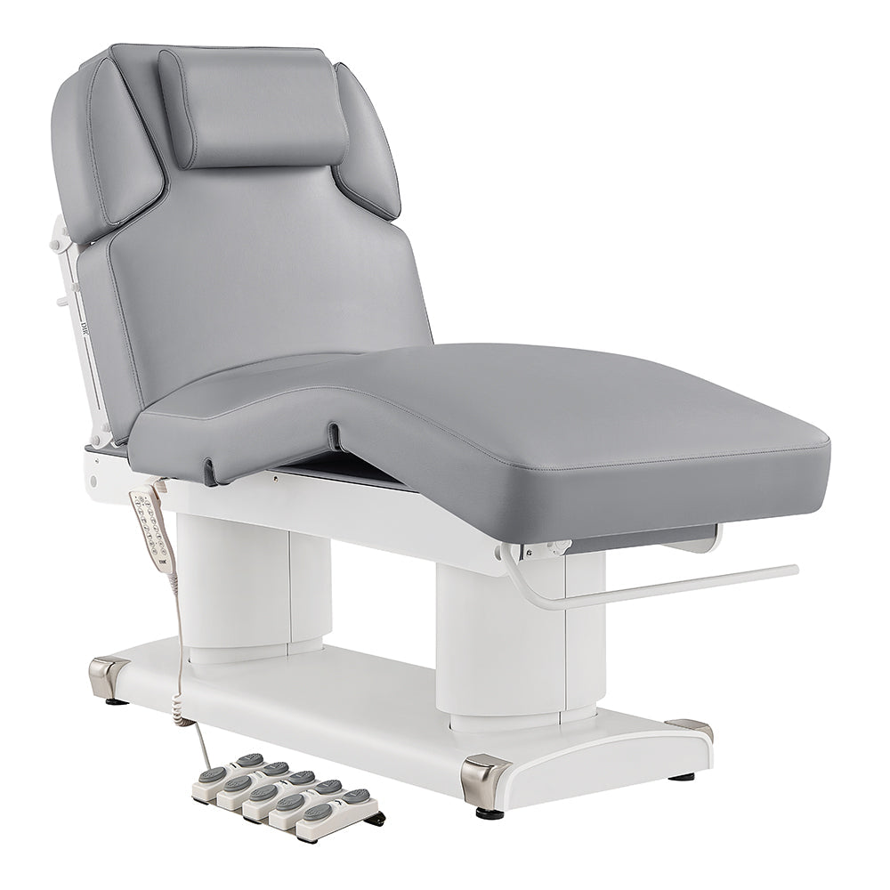 Gray Luxi 4 Motors Medical Spa Treatment Table DIR with foot controls on a white background