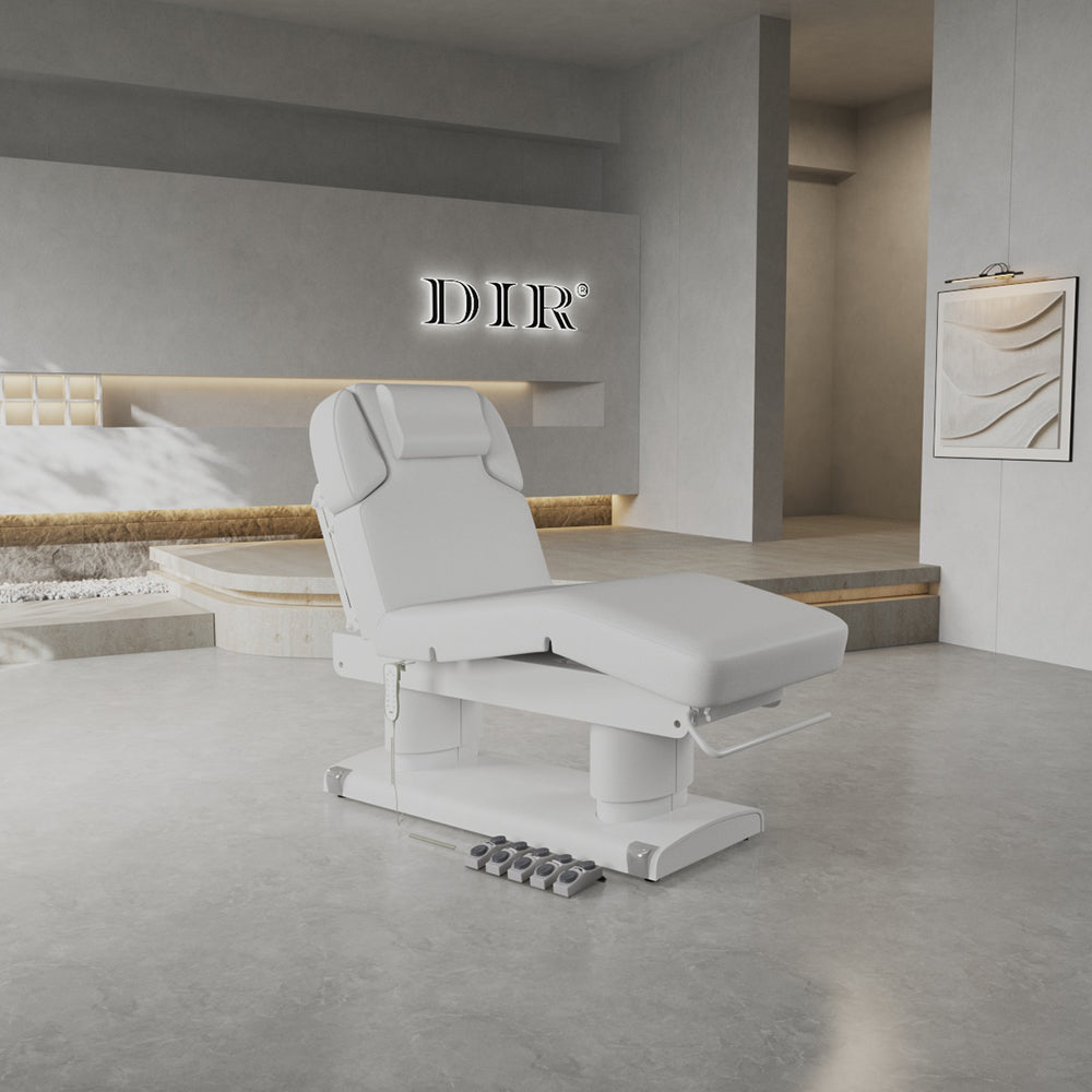 Modern white treatment chair in a stylish room with DIR logo on the wall.
