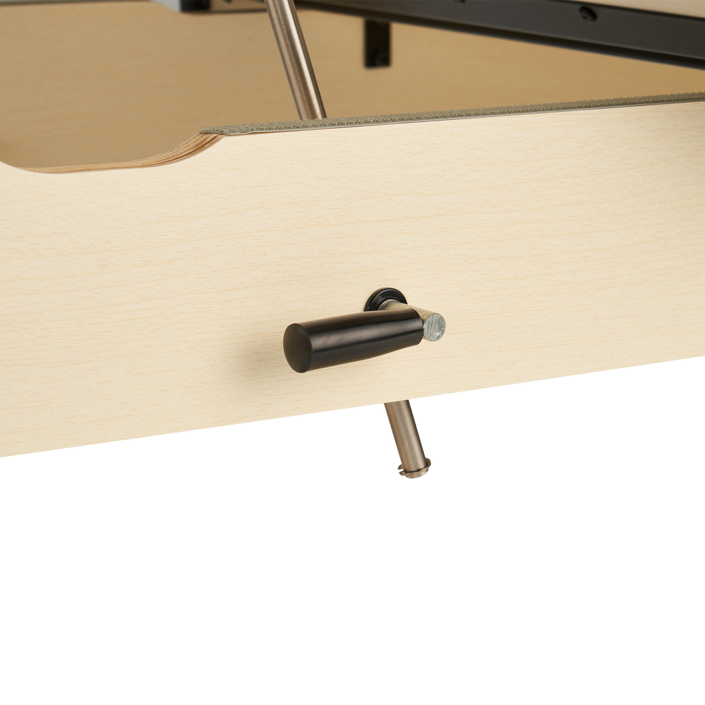 Close-up of a black lever handle on the MT Massage HARVEY TILT Stationary Table by MT.