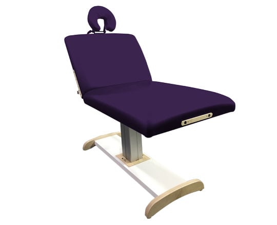 Purple massage table with wooden legs on a white background