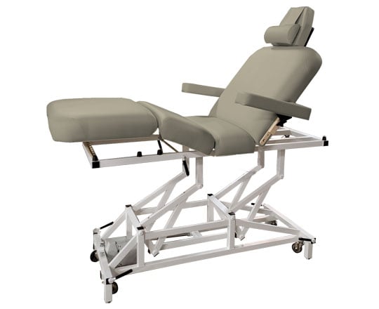 Buff McKenzie massage table with white metal frame on a white background