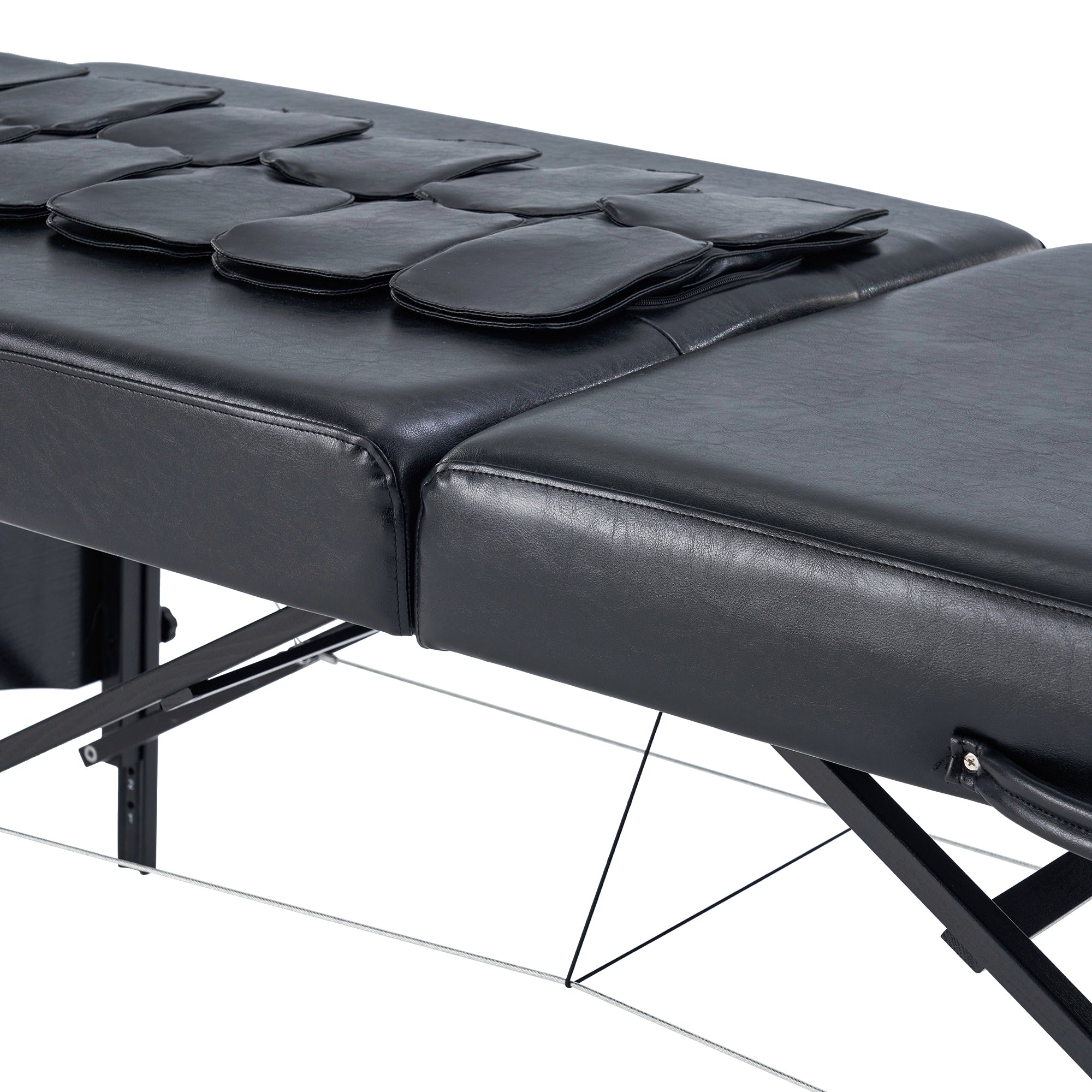 Close-up of the Master Massage MONACO AirWave Table with leather pads for targeted relief.