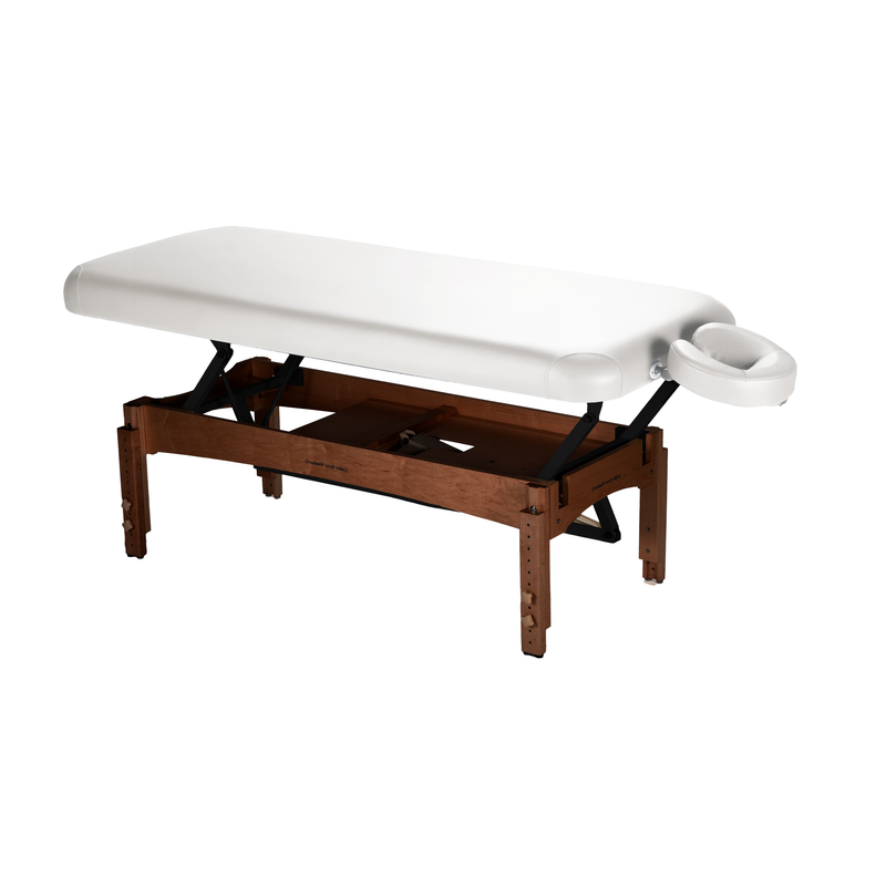TouchAmerica OLYMPUS FLAT Electric Lift Table with white cushioning and adjustable headrest.