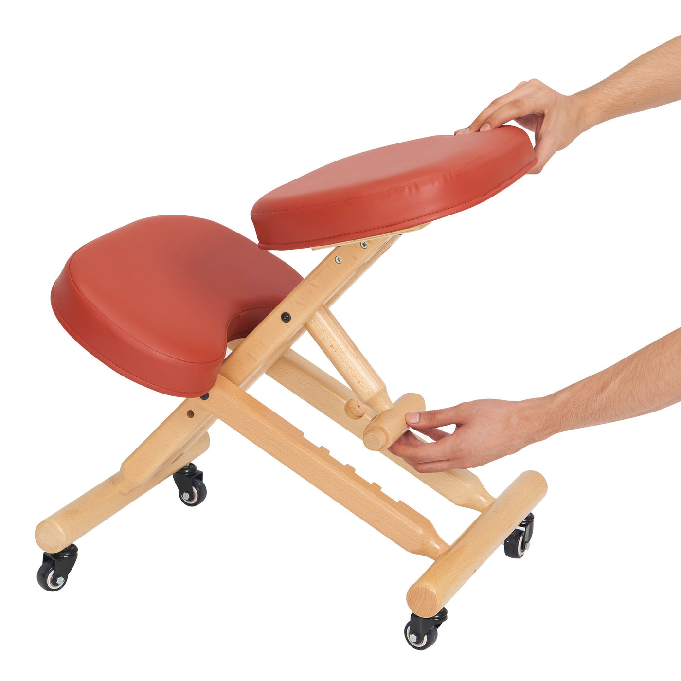 Kneeling chair with red pads and wooden frame on a white background