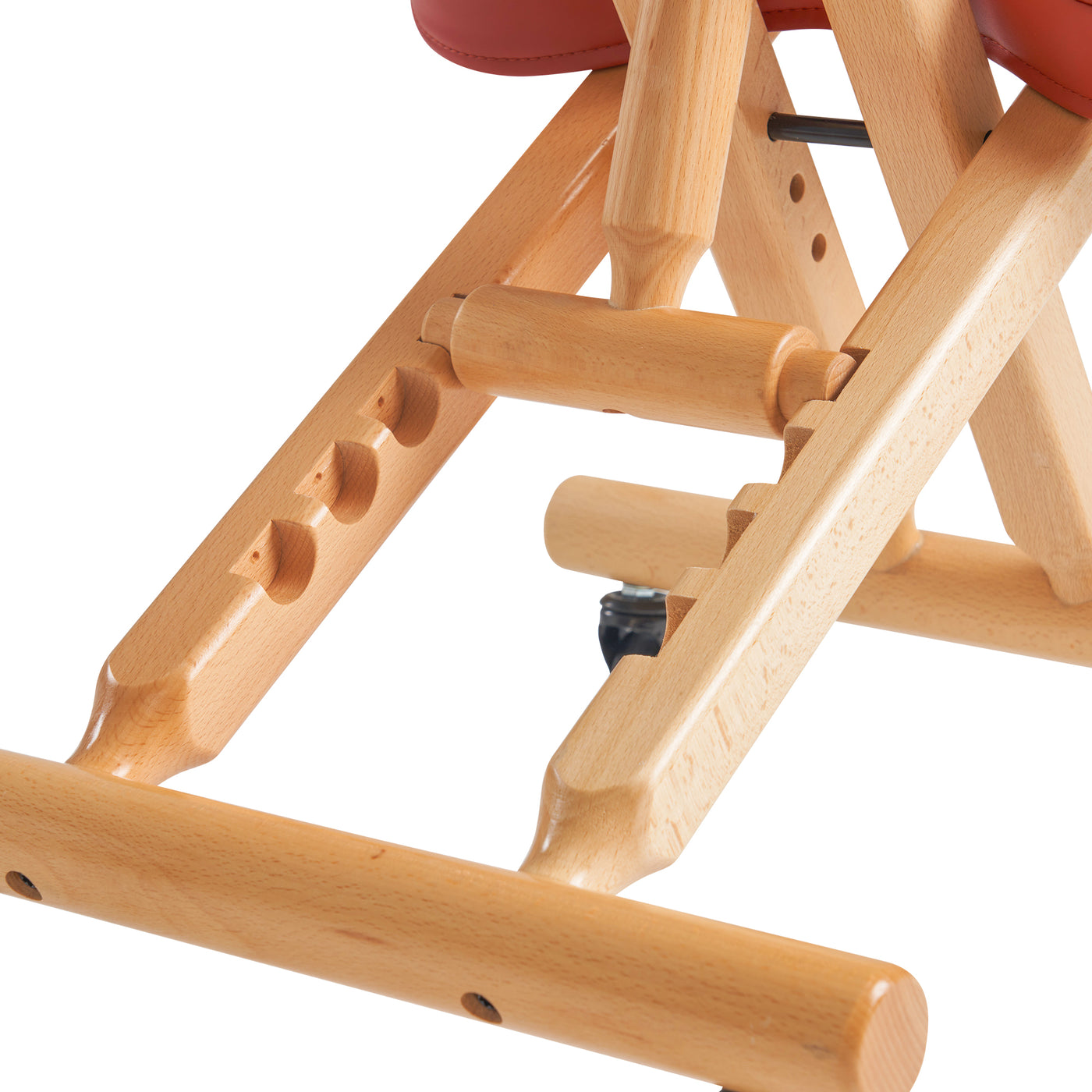 Wooden chair frame with cinnamon cushion on a white background