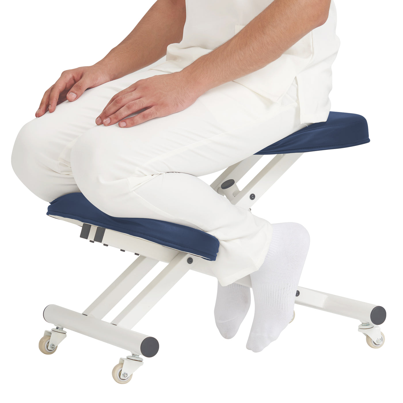 Person sitting on a blue and white adjustable stool with wheels on a white background
