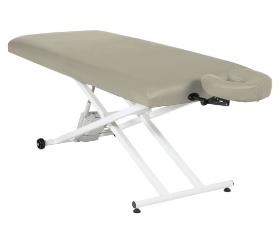 Pro Basic massage table with buff top and white base on a white background