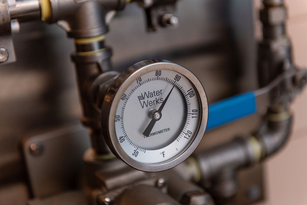 Close-up of a pressure gauge on a mechanical device with 'Water Werks' branding.
