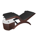 TouchAmerica S Pedi Lounge: reclining lounger with black cushion, wood base, and foot spa basin.