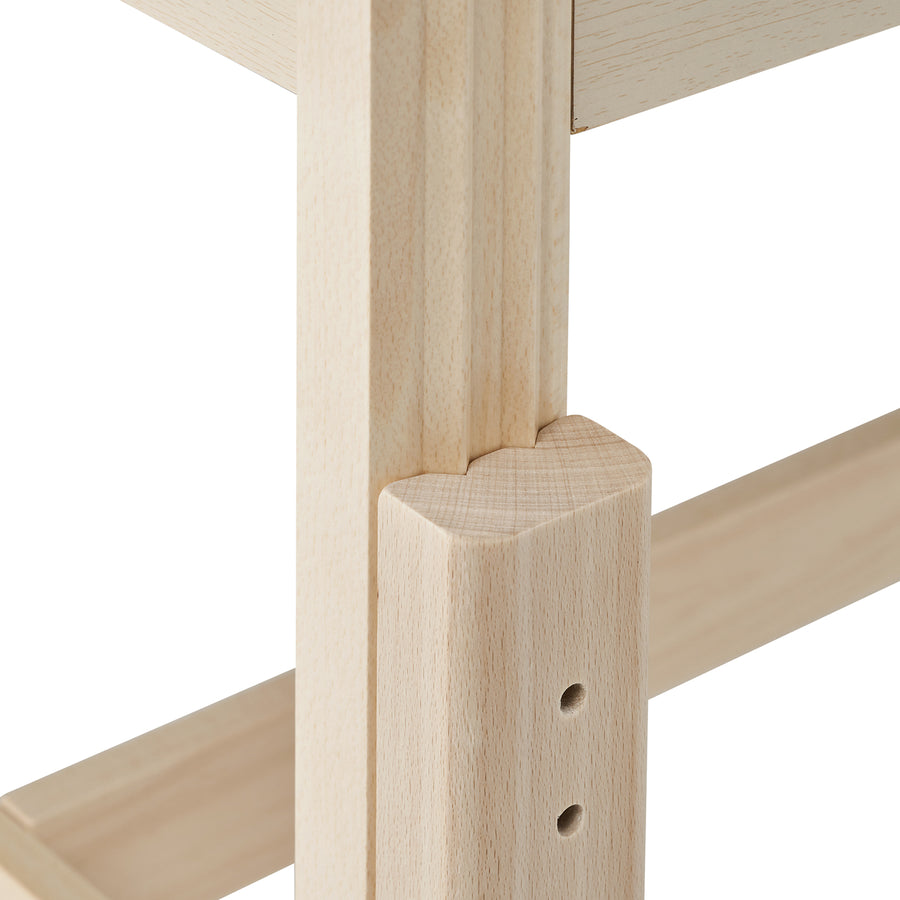 Close-up of MT Massage HARVEY Table's joined wood parts with pre-drilled holes.