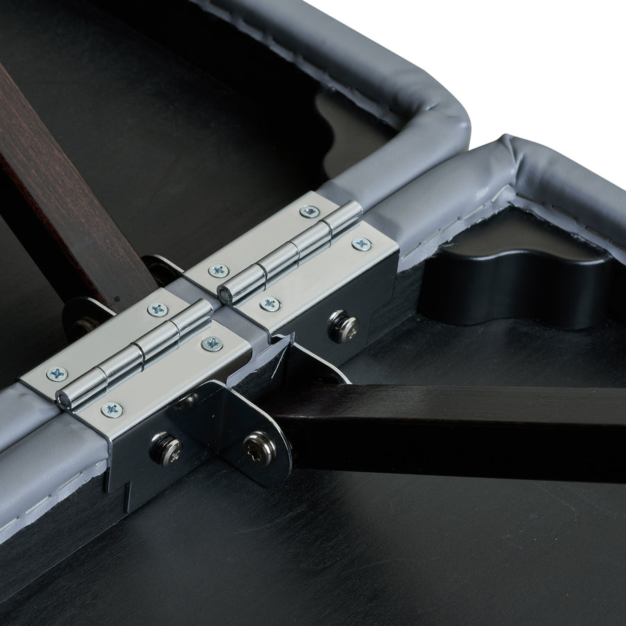Close-up of metal hinge and brackets on a Master Massage MONTOUR Massage Table underside.