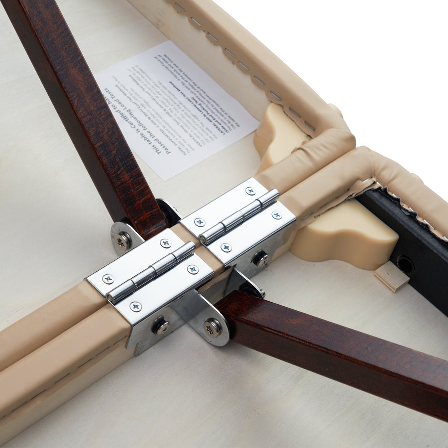 Close-up of metal hinges on Master Massage DEL RAY SALON Therma Top Portable Table’s padded surface.