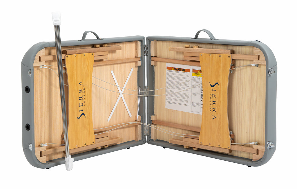 The Sierra Comfort Premium Wide Portable Massage Table folds open, showing internal supports.