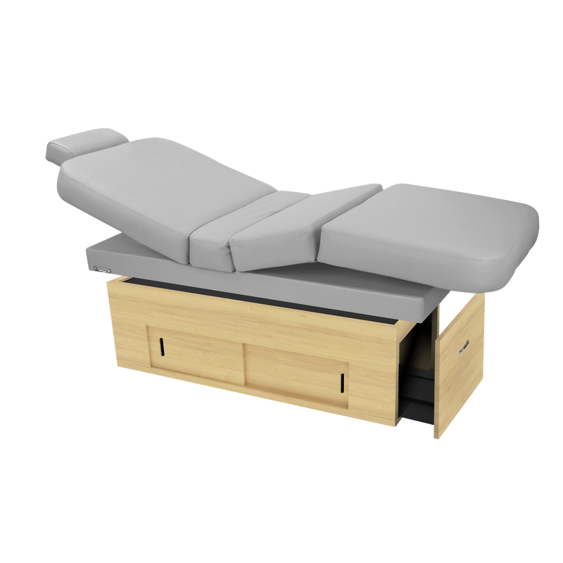 TouchAmerica SANYA POWERTILT Massage Table with gray cushions, wood base, and storage drawers.