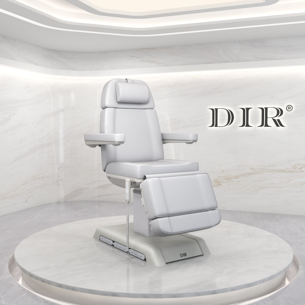 White medical examination chair on a circular platform with 'DIR' branding in a minimalistic setting.