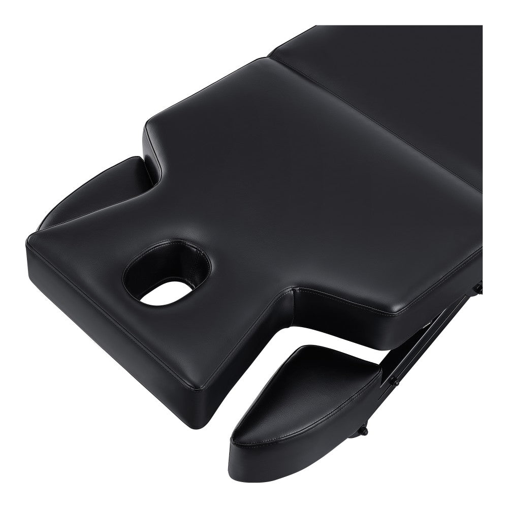 Black massage table on a white background
