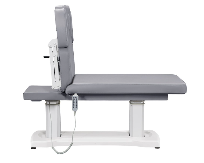 Tranquility 4 Motors Spa Table by DIR with gray padding and remote control attached.