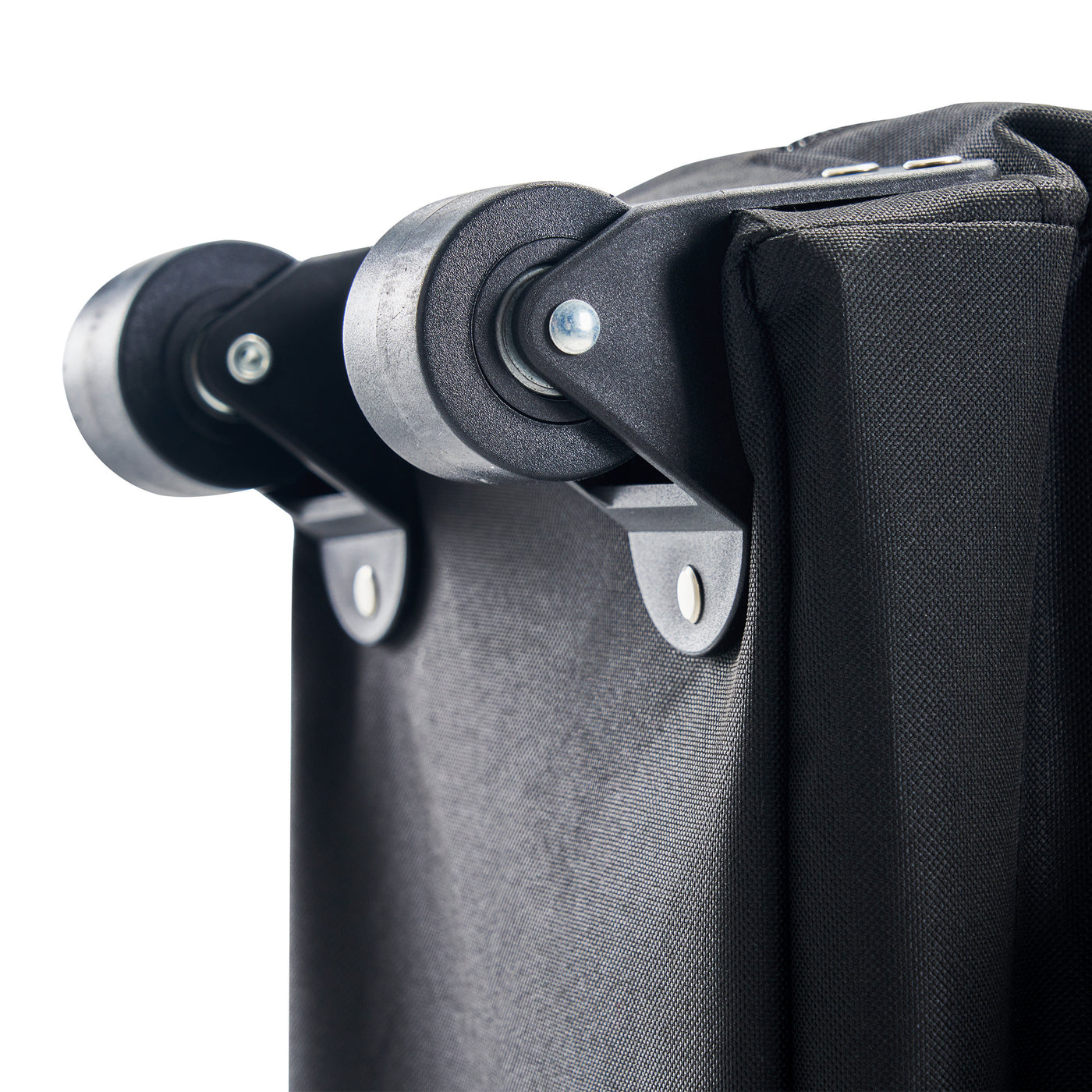 Close-up of a black carry case with black wheels on a white background