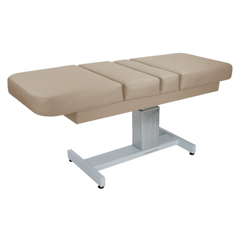 TouchAmerica VENETIAN MULTIPRO beige electric lift table with padded top and adjustable metal base.