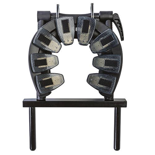 Black metal arch with multiple small rectangular objects on a white background