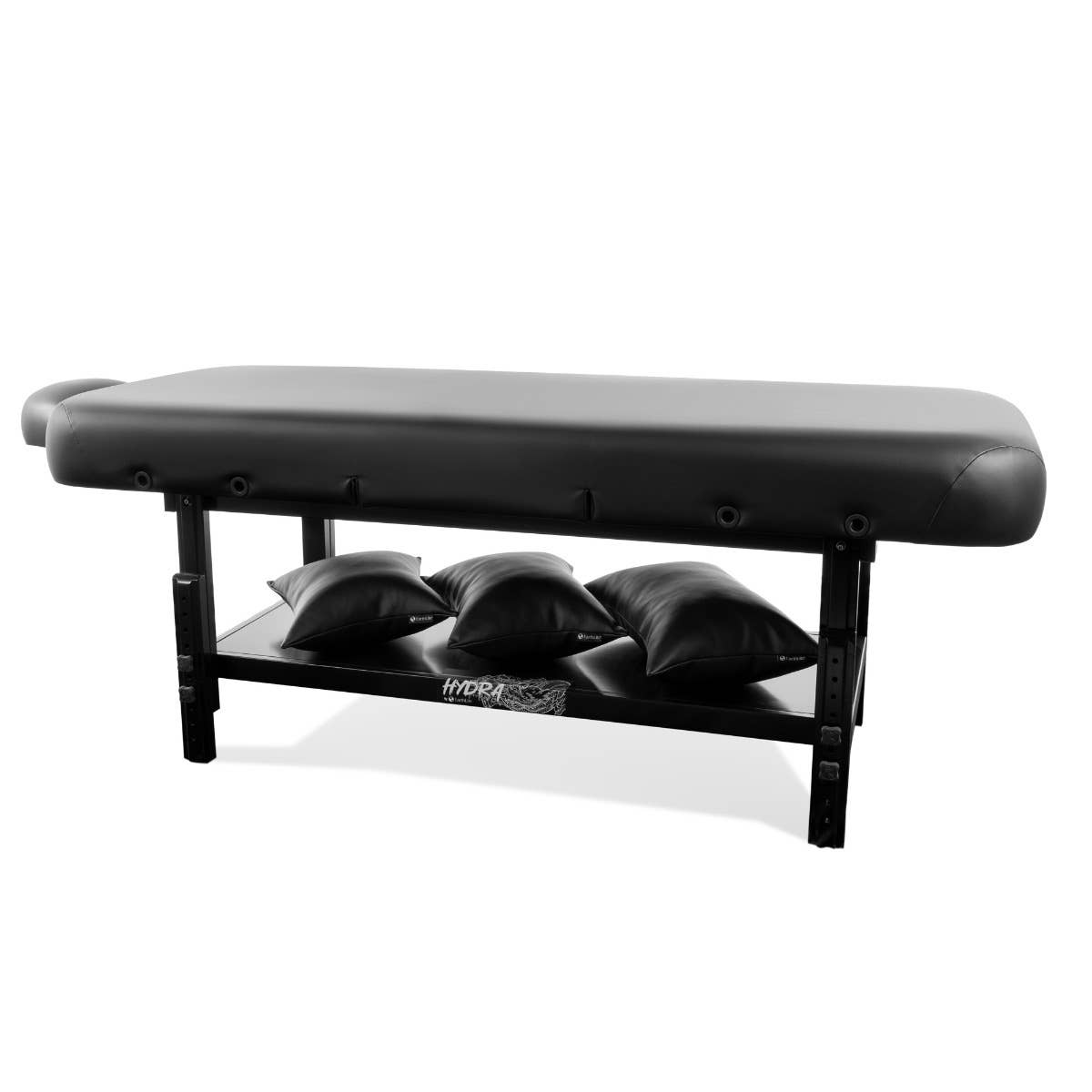 EarthLite HYDRA Stationary Tattoo Table with hardwood frame, four stacked cushions below.