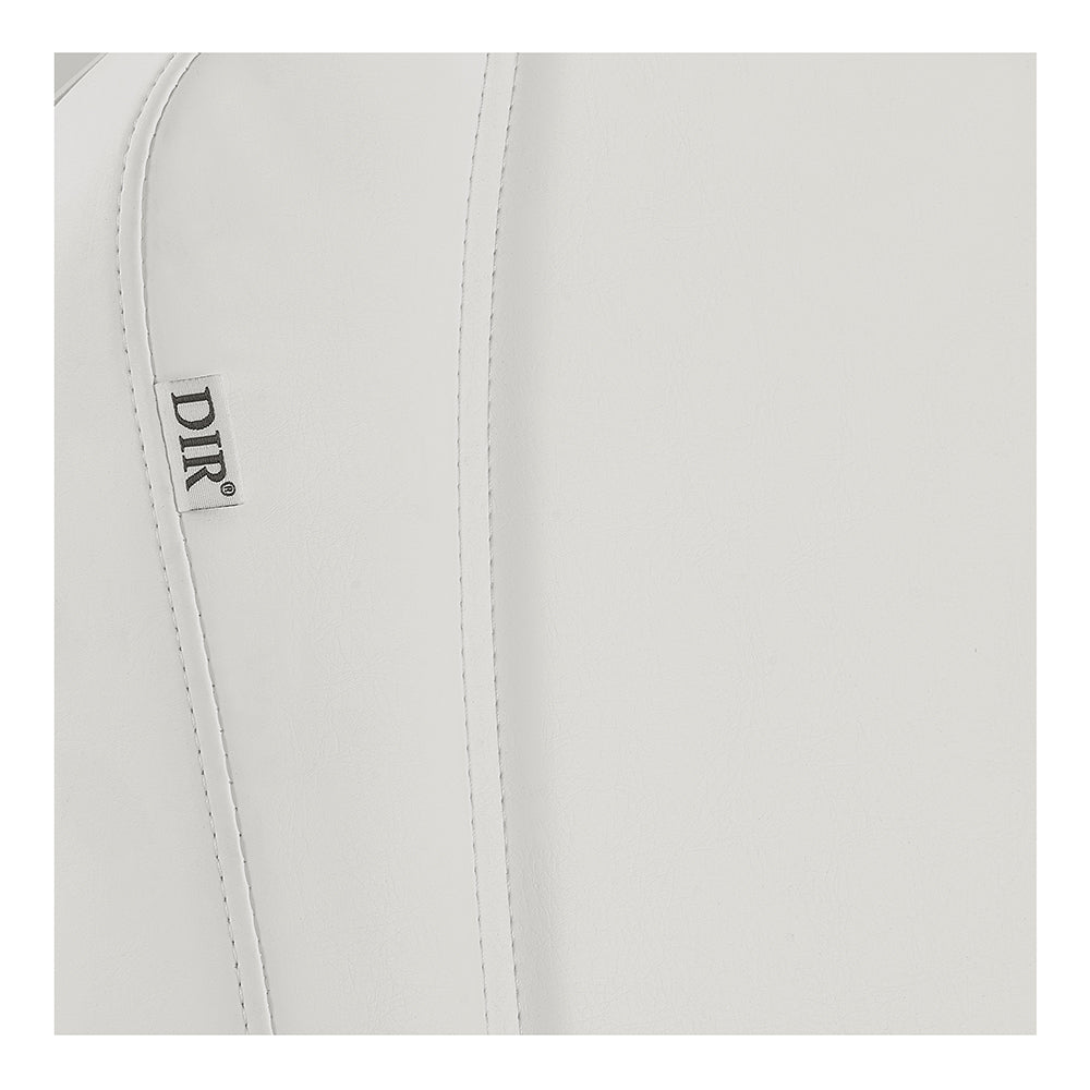 Close-up of DIR Pavo FACIAL Beauty Bed & Chair in White, featuring vertical stitching.