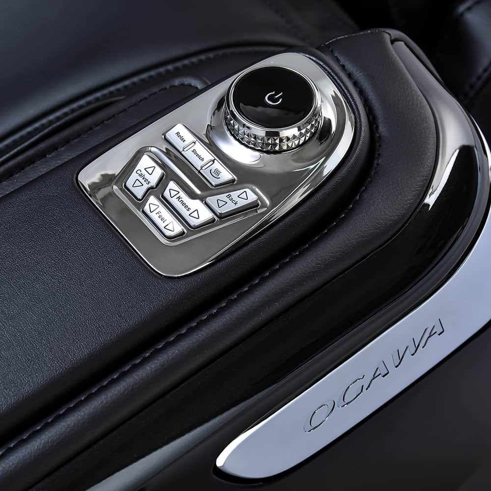Close-up of Ogawa Master Drive AI 2.0 massage chair control panel on black leather armrest.
