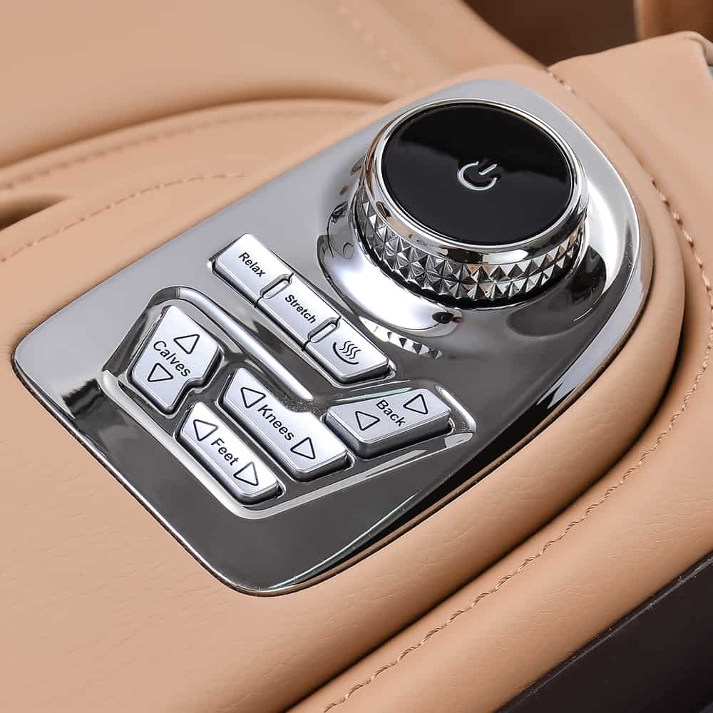 Close-up of Ogawa Master Drive AI 2.0 control panel with labeled buttons on a beige surface.