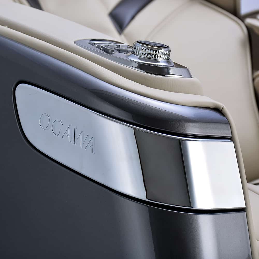 Close-up of the Ogawa Master Drive AI 2.0 Massage Chair control panel and metallic logo plate.