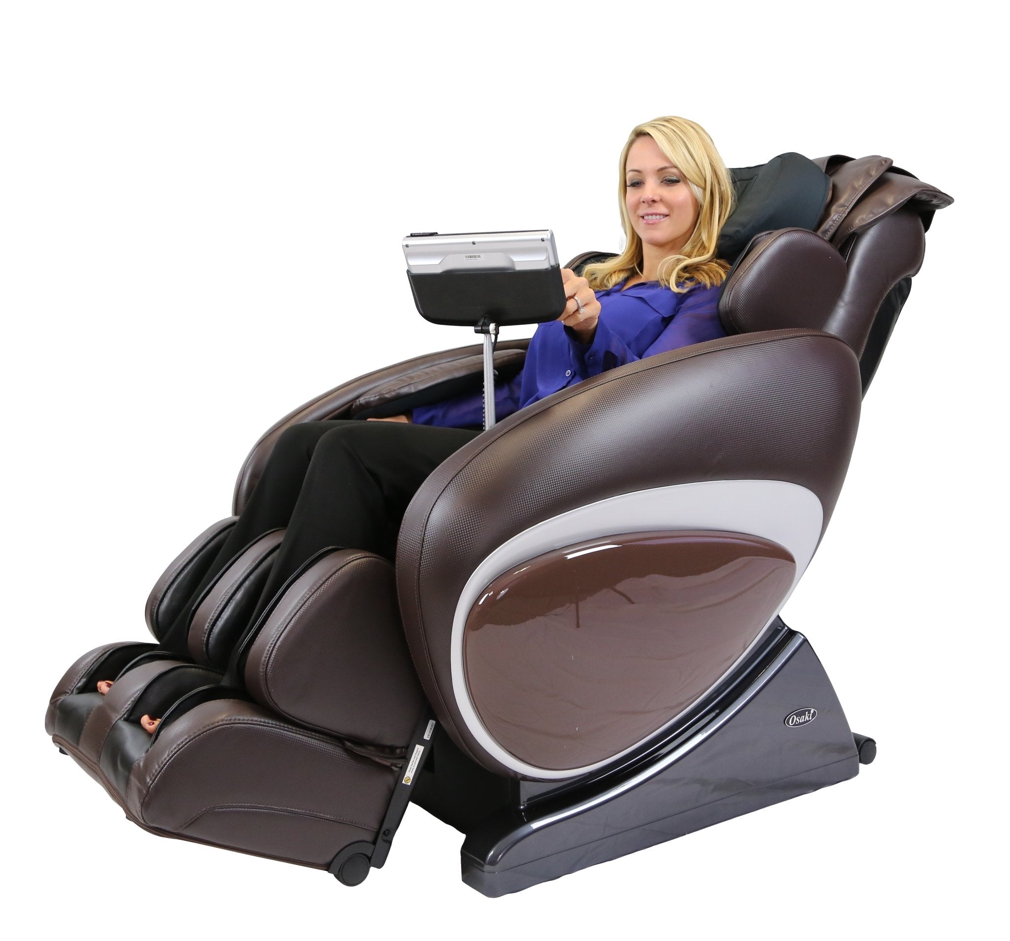 Woman relaxing in an Osaki OS-4000T massage chair with zero gravity and touchscreen controls.