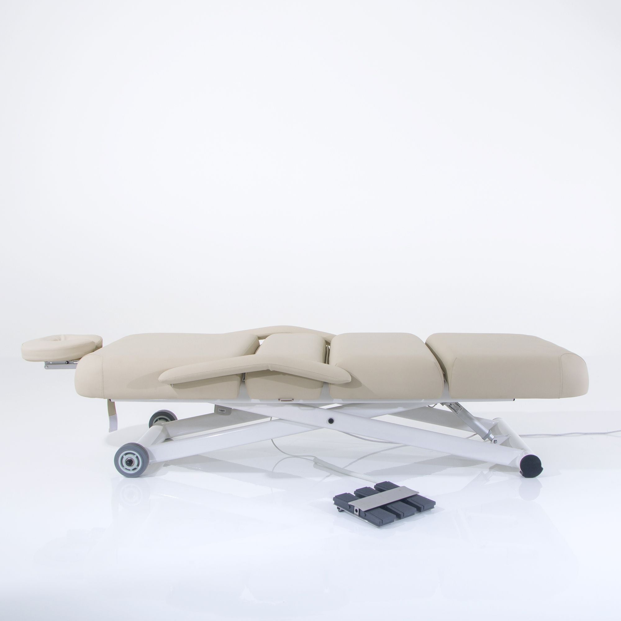 Silverfox America 2274B electric massage bed, ADA compliant with headrest and foot pedal control.