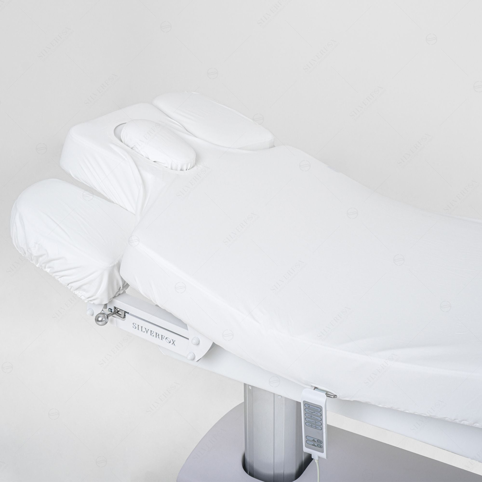 Silverfox America OCILI 2249 electric massage table with headrest and arm supports shown.