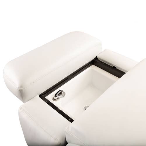 The Living Earth Crafts Pan Pacific Table is a white convertible chair with a built-in sink and faucet.