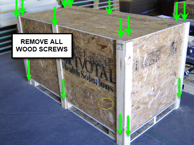 Wooden crates with text and instructions to remove wood screws, set against a warehouse background.