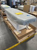 EarthLite SEDONA FLAT Massage Table with adjustable legs, covered, palletized with documents.