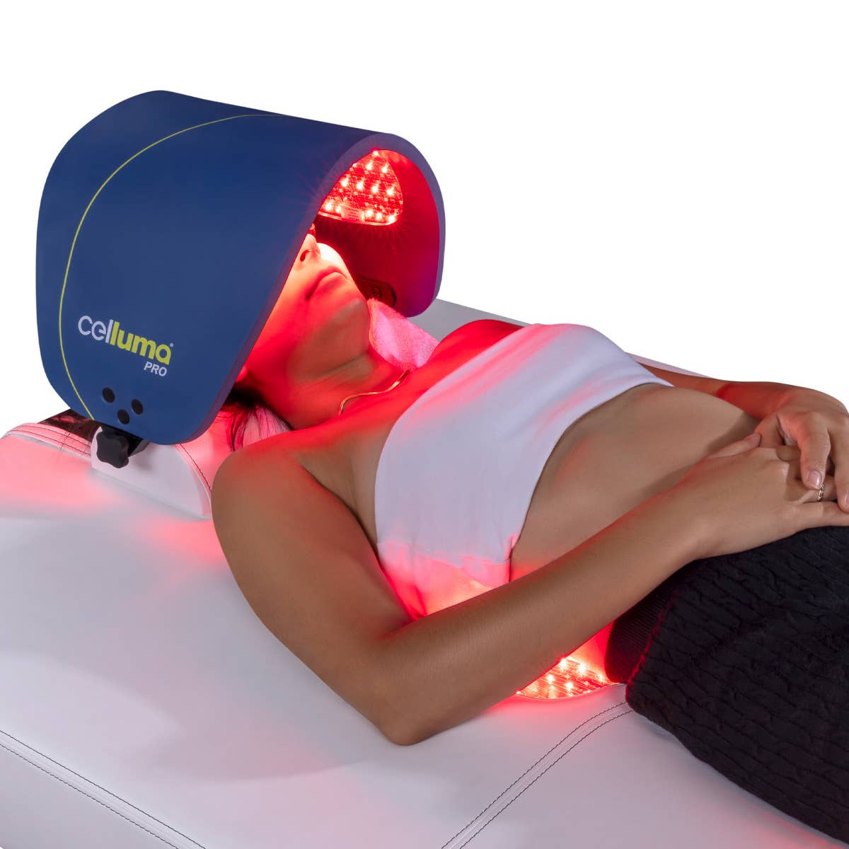 Person reclines on a Living Earth Crafts RADIANCE PT LED Light Therapy Treatment Table.