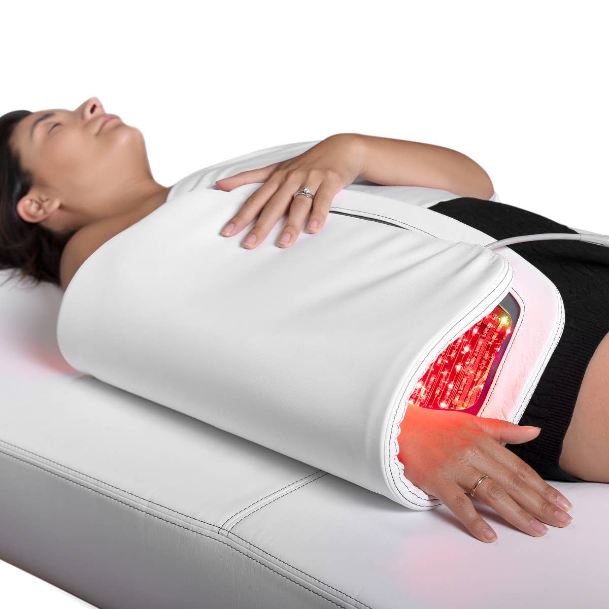 Person on a Living Earth Crafts RADIANCE PT LED Therapy Table with light belt around midsection.