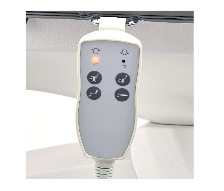 Close-up of DIR Serenity Electric Treatment Table's wired remote with buttons and indicator lights.